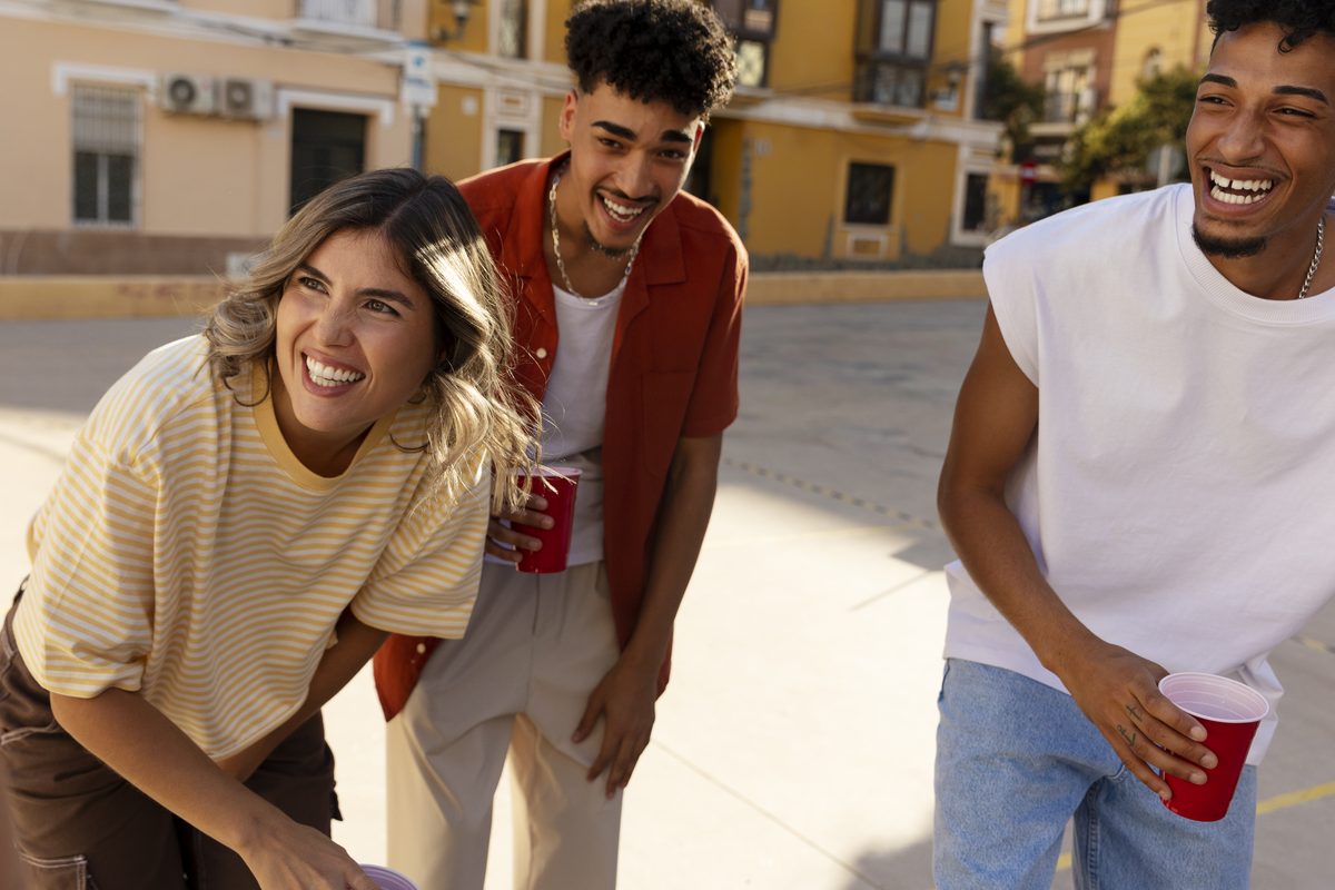 Diverse group of young adults together outdoors