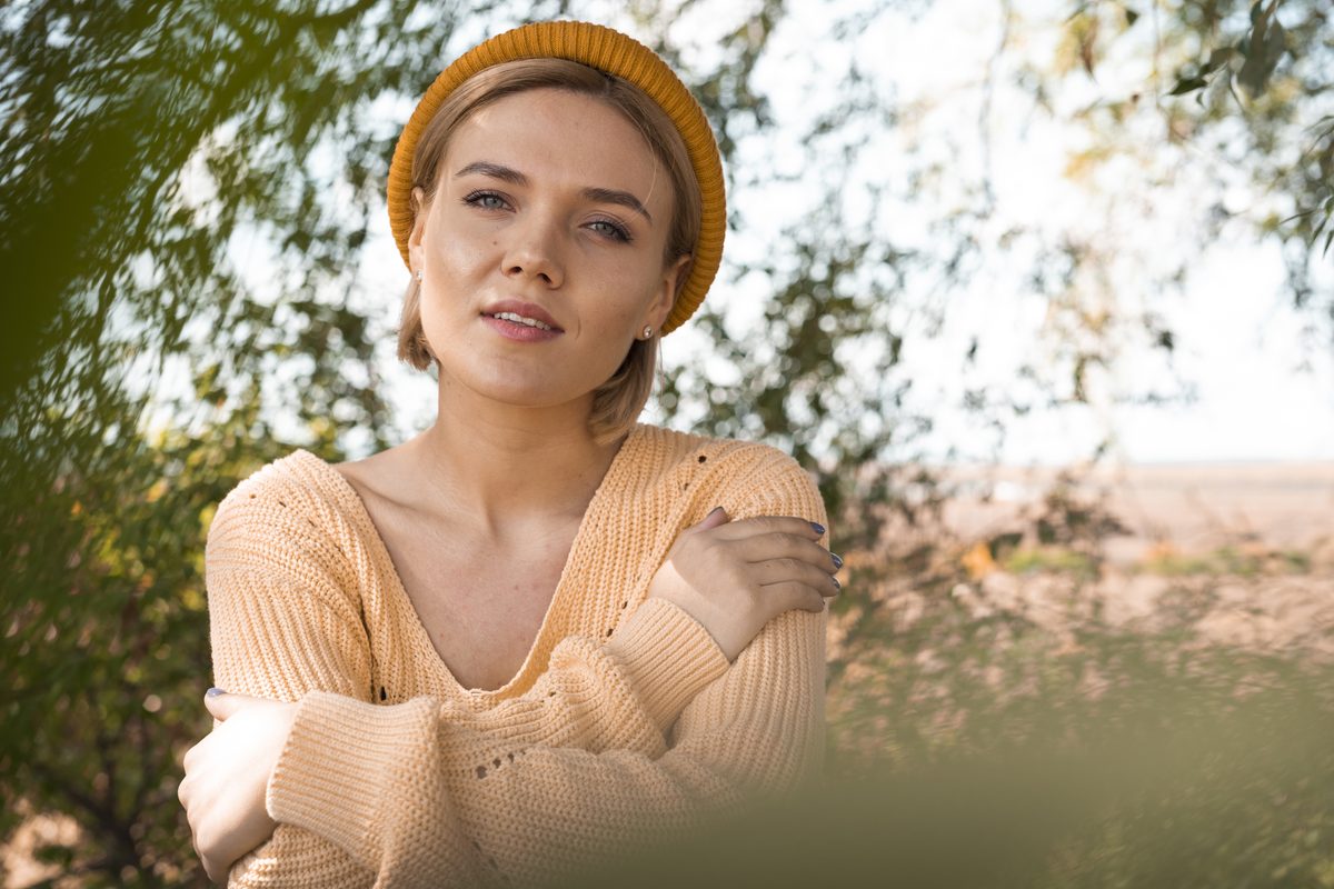 Young woman relaxed outdoors on a bright day