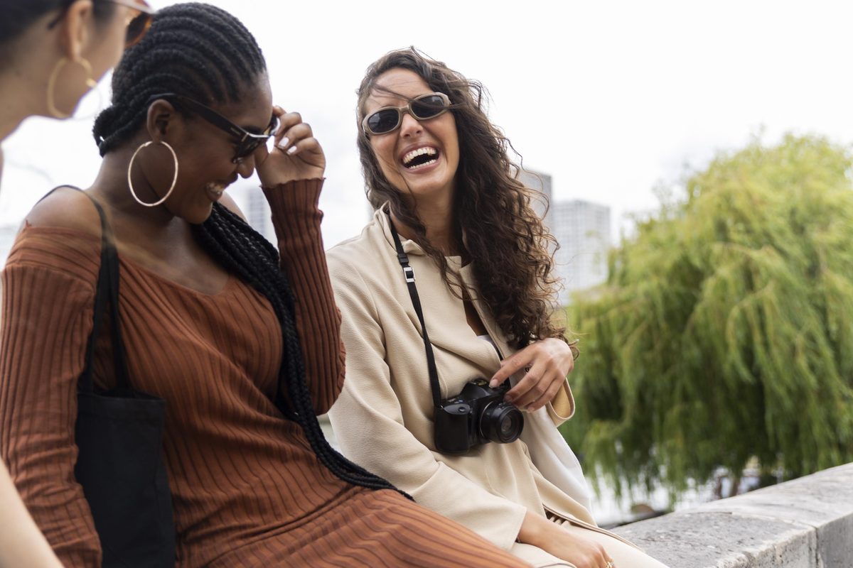 Two young women smiling together outdoors